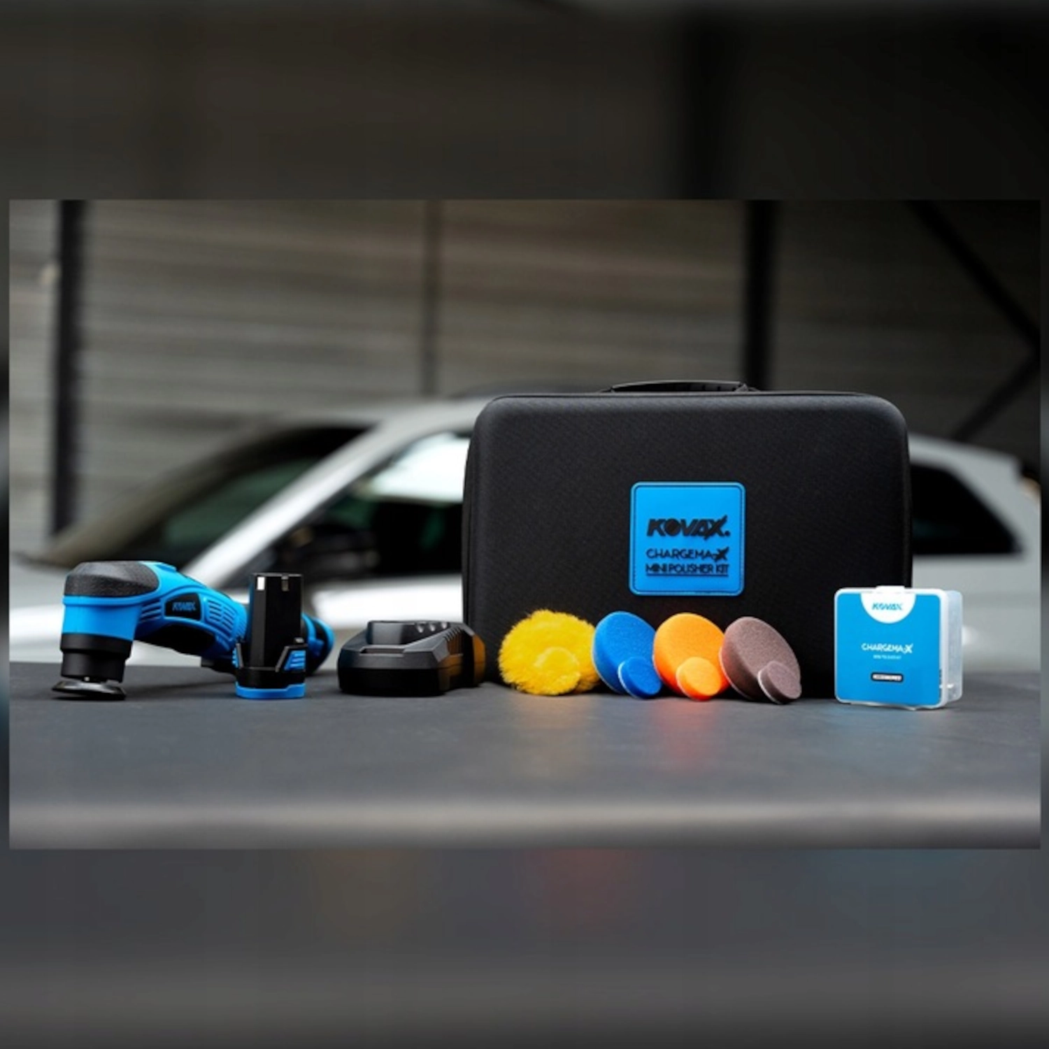 Kovax Chargema-X Mini Polisher Kit with black, orange and blue foam pads, yellow wool pad and carry case